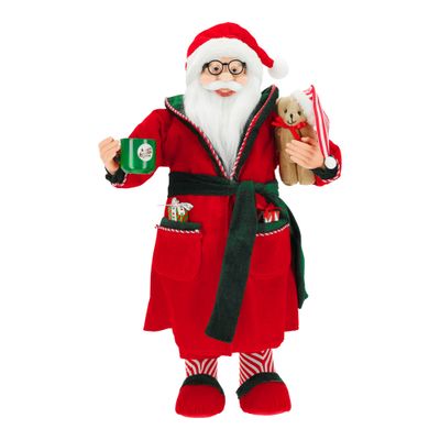 Le père noël debout en pyjama