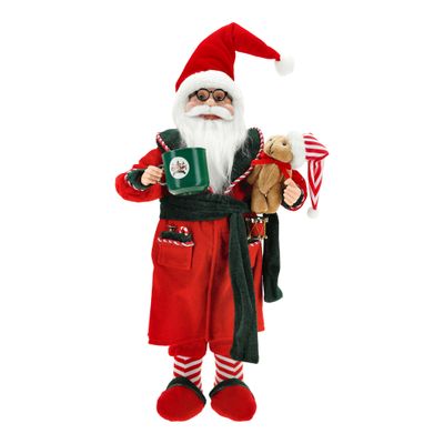 Le père noël debout en pyjama