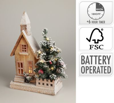 Huis met kerstboom en led